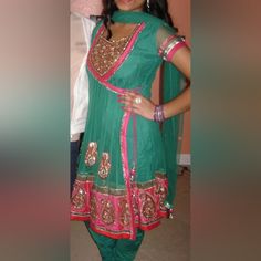 3 Piece Green And Pink Anarkali Style Salwar Kameez In Xs Initially Purchased For A Wedding And Only Worn A Couple Of Times From A Smoke Free, Pet Free Home Bollywood Style Green Churidar With Self Design, Green Bollywood Churidar With Self Design, Bollywood Green Self-design Churidar, Pink Self-design Churidar For Party, Pink Fitted Salwar Kameez With Cutdana, Fitted Churidar For Navratri Designer Wear, Fitted Bollywood Style Churidar With Self Design, Fitted Green Salwar Kameez With Mirror Work, Fitted Bollywood Style Churidar For Festive Occasions