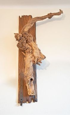 a piece of wood that has been carved to look like an animal's head