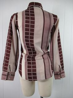 "Vintage 1970s women's disco shirt, mod blouse. Made of polyester. Color is burgundy and white. Has button down front and button cuffs. Made by Stitches. About a size medium. Actual measurements are: 35\" around the bust 30\" around the waist 14\" shoulder seam to shoulder seam 22.5\" shoulder seam to end of cuff 27\" overall length In very good condition." Retro Fitted Brown Blouse, Fitted Retro Brown Blouse, Fitted Retro Print 70s Inspired Tops, Fitted Brown Tops In 1970s Style, Fitted Brown Tops 1970s Style, Fitted Shirt With Retro Print For Fall, Fitted Brown 1970s Style Tops, Fitted Cotton Blouse With Retro Print, Fitted 70s Inspired Tops For Fall