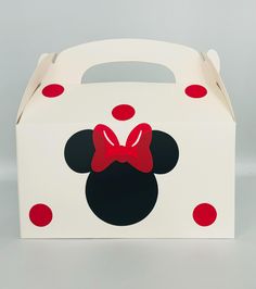 a white box with red polka dots and a minnie mouse bow on the front side