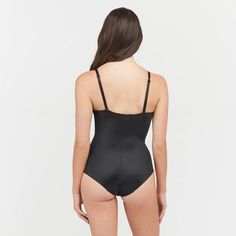 This versatile bodysuit is the ultimate solution for low-back dresses! The flawless-finish fabric is lightweight, cling-free, and offers 360 degrees of comfortable, single-layer shaping for a sleek, all-over feel. And, best of all? The innovative design features lightly padded, fit-flexible wireless cups and adjustable, convertible straps for a variety of styling options Second-skin Bodysuit With Spaghetti Straps And Built-in Bra, Sleek Second-skin Shapewear With Built-in Bra, Fitted Full Coverage Swimwear With Built-in Bra, Solid Nylon Bodysuit With Built-in Bra, Fitted Solid Shapewear With Built-in Bra, Stretch Backless Bodysuit With Built-in Bra, Stretch Nylon Bodysuit With Built-in Bra, Stretch Bodysuit With Built-in Bra, Backless Nylon Leotard With Built-in Bra