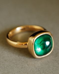 Description A strong, refined statement ring featuring a cushion-cut, responsibly grown Colombian emerald cabochon. No sharp facets or prongs to snag your blazer sleeve, just a delicious gumdrop of bright green held securely by a cup of 18k yellow gold. This is the emerald ring of your dreams. Designed to be worn everywhere and with everything, The Sovereign is just as cool with jeans and a t-shirt as it is with Gucci at the Met Gala. Pairs well with the Essential Band or the Dominus Band (each Emerald Cabochon, Luxury Jewelry Brands, Cushion Cut Ring, Colombian Emeralds, Emerald Ring, Bright Green, Cushion Cut, Custom Engraving, Statement Ring