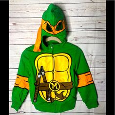 Ninja Turtles Graphic Sweatshirt Kids Cute Green Hooded Top, Playful Winter Tops With Character Print, Playful Winter Tops For School, Playful Winter School Tops, Playful Green Tops For Winter, Fun Winter Playwear Tops, Fun Winter Tops For Playwear, Ninja Turtle Shirt, Girl Sweatshirts