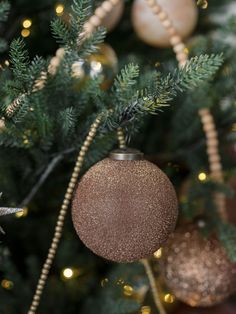 a christmas tree with ornaments hanging from it