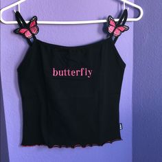 Black Spaghetti Strap Top With Appliqu Butterfly On Each Strap. Pink Scalloped Lower Edge Black Camisole Crop Top With Straps, Y2k Black Cami Crop Top, Black Strap Top For Spring, Black Y2k Camisole Crop Top, Casual Black Tops With Straps, Black Spring Tank Top With Straps, Spring Black Tank Top With Straps, Black Strap Tank Top For Spring, Black Tank Top With Straps For Spring