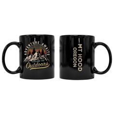 two black coffee mugs with the words, adventure await and mth hood on them