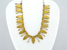 This Victorian Etruscan Revival gold necklace certainly falls under the category of 'Museum Piece'! During the Etruscan Revival period of the 1800's, jewelers and craftsmen sought to replicate the finely detailed gold work of the newly discovered ancient Etruscan artifacts. This is evident in this necklace: the quality of workmanship in the hollow-ware, filigree covered components is absolutely outstanding. Each piece slides individually on the original, woven chain. The condition is excellent, 22k Gold Victorian Ceremonial Jewelry, Victorian Hallmarked Necklaces For Ceremonial Occasions, Victorian Hallmarked Necklaces For Ceremonial Events, Victorian Hallmarked Necklace For Ceremonial Events, Ornate Ceremonial Hallmarked Necklace, Victorian Engraved Ceremonial Necklaces, Victorian Engraved Necklaces For Ceremonial Occasions, Victorian Engraved Necklace For Ceremonial Occasions, Elegant Antique Gold Ceremonial Necklace