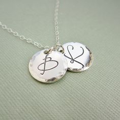 A beautiful piece to keep your loved ones close to heart! ~solid sterling silver ~hand stamped to order ~12mm diameter discs ~pretty, cursive font ~hand hammered edge finish ~choose your necklace length for the perfect fit >>To enter to my shop<< http://www.kgarnerdesigns.etsy.com CURRENT PRODUCTION TIME: Please contact me if you are on a deadline. I can usually accommodate requests for quick shipping if I'm made aware of your deadline. Please see individual listings for shipping inf Silver Letter Necklace, Ship Necklace, Heart Shaped Diamond Pendant, Sterling Silver Initial Necklace, Mom Necklace Personalized, Letter Necklace Silver, Norse Jewelry, Dainty Diamond Necklace, Viking Ship