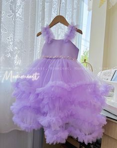 ** Please let a note about your current baby girl age/weight/height in checkout/inbox to help us prepare your order better ! Outstanding lilac / lavender baby girl ball gown dress with beautiful ruffles made by Mommiest. Waist is decorated by lovely beads, pearls. The back of the dress has a beautiful knitting straps part that helps to adjust the width.  They are perfect for any special occasions such as wedding, birthday, first 1st birthday, party, photoshoots, flower girl, gift... Material: tu Lavender Tulle Dress With Ruffles, Purple Tulle Dress With Ruffles, Lavender Ruffled Dress For Wedding, Purple Ruffled Ball Gown For Wedding, Lavender Princess Dress With Ruffles, Purple Ruffled Ball Gown For Pageant, Purple Ruffled Ball Gown For Pageants, Elegant Purple Ball Gown With Ruffles, Purple Ruffle Dresses For Pageant