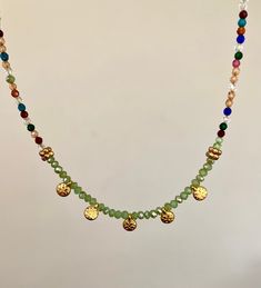 This beautiful multicolor gemstone necklace is a perfect gift for your loved ones; girlfriend, wife, mom, sister, best friend. This delicate, brightly colored necklace is the perfect fashion accessory and would complement any Mediterranean style. It is modern but inspired by antique jewelry. It is handmade with delicate brightly colored glass beads and finished with zamac gold coins made in Greece. Care instructions; Avoid contact with water or chemicals to preserve the gold plating and shine. Bohemian Party Necklace With Adjustable Chain, Bohemian Necklace With Adjustable Chain For Party, Bohemian Charm Necklace With Adjustable Chain For Party, Spiritual Green Jewelry With Adjustable Chain, Bohemian Green Jewelry As Gift, Bohemian Green Jewelry For Gift, Bohemian Green Jewelry Gift, Green Spiritual Necklace For Festival, Green Spiritual Necklace For Festivals