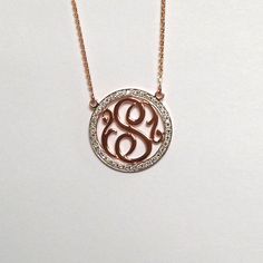 "The outer circle measures 0.75\" in diameter and is covered with beautiful F-G color, VS2-SI1 clarity diamonds. The outline is covered with approximately 40 brilliant, full-cut, round diamonds with a weight of 0.50 ct. In this absolutely stunning necklace, a diamond covered outline frames a gorgeous script single initial. Also, the 14k gold plate is significantly thicker and heavier than the plate used for our traditional monograms. This is necessary to accommodate the diamonds. This necklace c Luxury Rose Gold Monogram Jewelry, Luxury White Monogram Jewelry, Initial Diamond Necklaces, Diamond Initial Necklaces, Round Diamond Initial Necklaces, Fine Jewelry Diamond Necklace With Initials, Fine Jewelry Round Diamond Necklace With Initials, Personalized Luxury Diamond Necklace, Round Diamond Necklace With Initials In Fine Jewelry Style