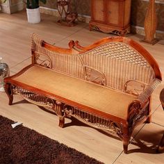 a wooden bench sitting on top of a hard wood floor