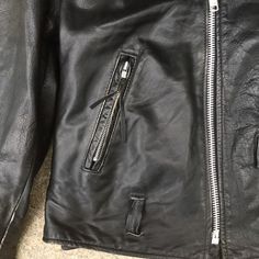 "Excelled black leather motorcycle jacket Harley Davidson patch insulated lining Size 48 Chest 48\", including gussets 56\" Waist 46\", sides lace so could be made bigger Arm 26\" Shoulder 21\" Length 24\" Condition - very good vintage missing belt" Vintage Black Leather Jacket With Front Zip, Vintage Black Outerwear With Zipper Closure, Retro Biker Jacket With Zipper For Biker Events, Vintage Black Leather Jacket For Biker Events, Vintage Biker Jacket With Zipper For Biker Events, Vintage Biker Jacket For Streetwear With Zip Detail, Vintage Biker Jacket With Zipper Closure, Vintage Biker Jacket With Zipper For Streetwear, Retro Leather Jacket With Zipper For Biker Events