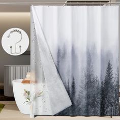 a shower curtain with a forest scene on it