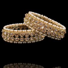 Exude elegance and timeless grace in these bangles! Traditional bangles featuring divinely intricate metal work and encrusted with champagne stones. Available in various sizes. Antique gold-plated on high-quality brass as base metal. In-stock & ready-to-ship. *Please Note: We use faux stones and beads in all of our jewelry.