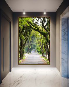 an empty room with trees in the middle and white marble flooring on both sides