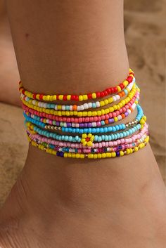 This multi-layered beaded anklet set features a beautiful yellow flower design with random color beads. Each layer adds depth and charm, making it the perfect accessory for any summer outfit. Handcrafted with precision and attention to detail, this anklet set is sure to make a statement. Anklet Set, Beaded Anklet, Ankle Jewelry, Bohemian Aesthetic, Tiny Beads, Bright Eye, Color Beads, Plastic Crafts, Charm Making