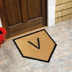 a door mat with the letter v on it