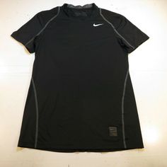 the nike shirt is black and has grey trim