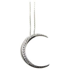 This is part of Chairish’s Fine Jewelry assortment.  This 18k white gold crescent moon necklace is encrusted with sparkling diamonds. The crescent moon has a rounded shape, with wonderful dimension—when it hangs from the chain it has depth that draws the eye to this excellent piece. Circa 1980’s, this vintage necklace is Italian made. It provides a great contrast when paired with yellow gold, offering a nice cool pop, as if glowing “by the light of the silvery moon.”   There are 29 single cut di Gold Crescent Moon Necklace, Crescent Moon Necklace Gold, Gold Crescent Moon, Crescent Moon Necklace, Modern Necklaces, Moon Necklace, Sparkle Diamonds, Contemporary Fashion, Crescent Moon