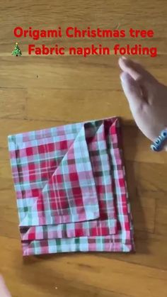 an origami christmas tree folded fabric napkin folding