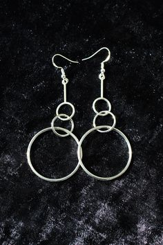 "Simple, modern and pretty lightweight for their size, these earrings will still make a statement and create a lot of movement around your face. You'll get to select your preferred ear wire type and a style variation. I offer sterling silver and non-precocious metal ear wires, which is reflected in the price. The last photo will help you figure out the type you want.  The style variation is very subtle. Pick the mirror polished \"smooth\" option if you are an elegant minimalist, or the \"texture Trendy Silver Jewelry With Simple Design, Trendy Sterling Silver Jewelry With Simple Design, Minimalist Metal Earrings For Party, Modern Silver Hoop Earrings For Party, Modern Sterling Silver Drop Earrings, Trendy Simple Metal Jewelry, Minimalist Single Metal Earring, Modern Sterling Silver Dangle Jewelry, Modern Hypoallergenic Sterling Silver Jewelry