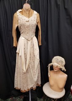 Authentic 1900s Edwardian Victorian Cream Linen w Lace & Ribbon Accents Day Touring Walking Suit 2 Piece Jacket and Skirt and Matching Hat.  Top features 25 hidden hook & eye front closure, corset boning, and gorgeous lace accents.  Skirt features a metal back zipper, buttons, draped material, and ribbon accents.  Hat is very delicate sheer material attached to a wire base.  Outfit is in amazing well worn antique condition, some very small imperfections...see pics! Top Measurements: shoulder to Historical Design Vintage Dress For Costume, Victorian Style Vintage Dress For Costume, Victorian Vintage Dress For Costume, Fitted Historical Vintage Dress, Fitted Historical Costume Vintage Dress, Vintage Fitted Victorian Dress For Costume, Vintage Fitted Victorian Costume Dress, Vintage Dress With Historical Design For Costume, Cream Victorian Dress With Historical Design