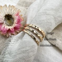 materials:•yellow 14K Gold size & styles:•Smooth: 1.6mm•Textured: 1.8mm•Hammered: 1.8mmSee the minimalist version of these bands hereSee the thicker version of these bands heregold guarantee:•14K Gold will not tarnish•heirloom quality, this piece will last lifetimes•it is a great metal for sensitive skin•your order will qualify for complimentary tracked + express shipping•all solid 14K orders will require a signature upon deliveryFollow along @openfirejewellery.Handmade in Canada using quality materials.Carefully made & intentionally designed for long term wear. Everyday Hammered Recycled Gold Rings, Hypoallergenic 14k Yellow Gold Midi Rings, Minimalist Hand Forged Gold Midi Rings, Everyday 14k Gold Diamond Cut Bands, Hammered 14k Gold Jewelry, Hammered 14k Gold Band Jewelry, Hammered Yellow Gold Rings For Everyday, Hammered 14k Gold Round Band Jewelry, Adjustable Yellow Gold Thick Band Stackable Rings