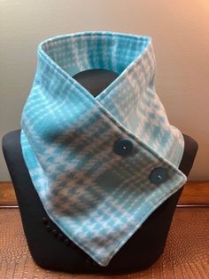 Hand sewn with love is this warm & comfortable aquamarine green plaid neck warmer scarf with two buttons that will keep you warm during the cold winter months.   This  scarf can be worn under a coat to go out in or as a decorative accessory to your daily work attire.   Neck warmers make a great alternative to a bulky scarf.   Each neck warmer scarf is individually handmade with close attention to detail and I select only high quality fabrics that will work for the item I am making. I work in a s Poncho Pattern Sewing, Bulky Scarf, Fleece Projects, Neck Warmers, Fleece Scarf, Scarf Neck, Poncho Pattern, Pattern Sewing, Warm Scarf