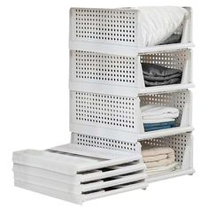 three white baskets stacked on top of each other