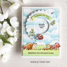 a card with some flowers on it and a white flower next to it that says sending you big hug hugs