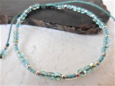 "This sparkly turquoise beaded bracelet or anklet, which I call Fire Polish Slider, is made with small Czech fire polish beads in light aqua AB, turqoise seed beads, silver seed beads and is strung on beautiful and durable nylon cord in Sea Green and finished with a small sliding knot. The bracelet fits a 6\" wrist comfortably when all the way closed, and has enough cord to open up to 9.5\". The anklet fits an 8\" anklet comfortably and opens up to 12\" to go over the foot. When closed completel Sliding Knot Bracelet, Affirmation Bracelets, Turquoise Anklet, Spiritual Bracelets, Crystal Anklet, Turquoise Bead Bracelet, Morse Code Bracelet, Daughter Jewelry, Bracelet Friendship