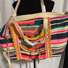 America And Beyond Nwt Tote. This Stunning Tote Is Hand Embellished With Thousands Of Beads And Rows Of Embroidery In Shades Of Roses Pink, Baby Blues, Silver, And Sunny Yellows. Micro Pom Pom Line The Amazing Bead Work Which Then Gives Way To Handwoven Jacquard. Light Weight But Roomy, This Bag Can Take You From Lunch With The Girls And Is Perfect For An Holiday Trip. Whether You're Headed Out The Door Or Jumping On A Plane, This Will Be The Bag You Grab For Years To Come. Handwoven Jacquard Be Multicolor Beaded Bags For Summer, Summer Multicolor Beaded Bag, Multicolor Beaded Vacation Bag, Vibrant Multicolor Bags For Summer, Multicolor Beaded Shoulder Bag, Vibrant Multicolor Summer Bags, Multicolor Embroidered Vacation Bag, Vacation Bag With Multicolor Embroidery, Spring Multicolor Beaded Bag