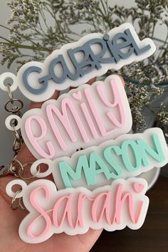 three keychains with the words, family and mason smith on them in different colors