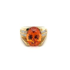 GIA Certified Unisex Ring in 18K Yellow Gold, weighing 14.90 grams, boasting a 13.5 carat oval cut Spessartine Garnet center stone. The vibrant orange gem is superbly clean and lustrous. Exploding with color and brilliance. Adorned with 16 princess cut diamond side stones, totaling 0.96 carats.  This Spessartine Garnet is extremely rare due to its rich Mandarine Orange color, lack of inclusions, and 13.5 carat size.   Item Details: - Type: Unisex Ring  - Metal: 18K Yellow Gold  - Weight: 14.90 Grams  - Setting: 4-Prong  - Size: 7.5 (adjustable) - Mounting: 17 MM elevation  ___________________________  Center Stone Details: - Type: Spessartine Garnet  - Carat: 13.5  - Cut: Oval-Brilliant - Color: Mandarine Orange  - Measurements: 14.24 x 10.75 x 8.08 MM   GIA Certificate #: 6234022072  GIA Modern Orange Oval Rings, Classic Orange Rings With Polished Finish, Orange Rings With Center Stone For Formal Occasions, Formal Orange Rings With Center Stone, Luxury Orange Gemstone Ring, Formal Orange Ring With Center Stone, Formal Orange Jewelry With Center Stone, Formal Orange Jewelry With Accent Stones, Formal Orange Oval Rings