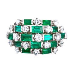 A fine diamond and emerald cocktail ring. Contains 19 round brilliant diamonds and 14 rectangular step cut emeralds set in platinum. Diamonds are ~2.30 ctw. Emeralds are ~3.50 ctw. Currently size 5-1/2 US and complimentary resizing from 3.5 - 8 US. No. 6630 Gemstone Wedding Ring, Round Cut Diamond Ring, Emerald Ring Vintage, Gemstone Wedding Rings, Vintage Jewlery, Platinum Diamond Rings, Green Room, Fine Ring, Wedding Rings Vintage