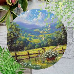 a painting of a bicycle in a field with mountains and flowers on the other side