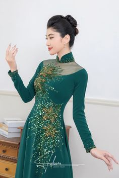 Traditional collar Material: Crepe, beading Long sleeves Type: Modern ao dai Fitted Long Sleeve Embellished Ao Dai, Fitted Evening Ao Dai With Floral Embroidery, Embellished Fitted Long Sleeve Ao Dai, Elegant Embellished Long Sleeve Ao Dai, Elegant Embellished Fitted Ao Dai, Embellished Fitted Elegant Ao Dai, Elegant Ao Dai With Floral Embroidery For Festive Season, Embroidered Long Sleeve Ao Dai For Party, Elegant Embroidered Ao Dai For Party