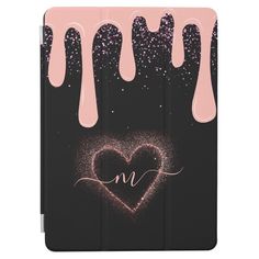 an ipad case with liquid drips and a heart on the cover that says m