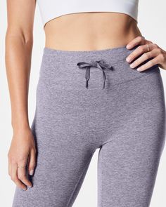 Our cozy, peachy-soft high-rise leggings feature a built-in waistband that gently smooths your curves with light core compression—plus an adjustable tunnel drawstring for the perfect fit. Made with super-soft fabric with 4-way stretch in a heathered, tonal design, these leggings are enhanced with strategically placed and engineered back-v-seaming that defines the booty. The result? A look that suits low-impact movement and just-as-easygoing outings.​ | Spanx Women's SPANXsmooth SoftStretch High-Rise Leggings Functional Compression Activewear With Elastic Waistband, Functional Compression Activewear, Functional Stretch Activewear With Elastic Waistband, Functional Compressive Yoga Pants With Elastic Waistband, Sporty Seamless Comfort Stretch Yoga Pants, Sporty Seamless Stretch Yoga Pants, Comfort Stretch Seamless Athleisure Pants, Athleisure Seamless Pants With Comfort Stretch, Seamless Comfort Stretch Athleisure Pants