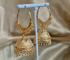 Light weight jhumka hoop earrings in bright gold finish 2.5 inch length x 1 inch wide for bell  Ready to ship! Heavy Gold Hoop Earrings For Festive Occasion, Heavy Gold Hoop Earrings For Festivals, Gold Bollywood Hoop Earrings With Intricate Design, Bollywood Style Gold Hoop Earrings With Intricate Design, Gold Bollywood Hoop Earrings For Party, Gold Tilla Hoop Earrings Bollywood Style, Gold Bollywood Hoop Earrings With Tilla, Gold Heavy Hoop Earrings For Parties, Heavy Bollywood Hoop Earrings