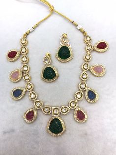 All our pieces are in stock and will be dispatched within 24 to 48 hours of order. Orders received during the weekend will be dispatched on Monday One of our favorite picks for the wedding season or festival season 2022❤️ Comes with an adjustable string Material: Brass and copper mix, gold polish, cz stones, polki Kundan, carved Quartz stones Elegant Festive Multi-stone Necklaces, Elegant Multi-stone Necklaces For Festive Occasions, Elegant Multicolor Necklace For Festive Season, Elegant Multicolor Kundan Necklace, Multicolor Jewelry Sets With Intricate Design For Celebration, Elegant Multi-stone Kundan Necklace For Festive Occasions, Elegant Multi-stone Kundan Necklace For Wedding, Fusion Style Multicolor Bridal Necklace With Intricate Design, Multicolor Intricate Design Necklace For Wedding