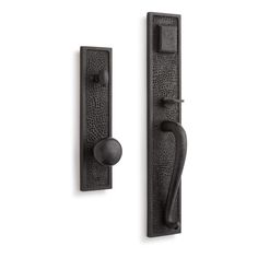 an iron door handle and knob on a white background, with the handles in black