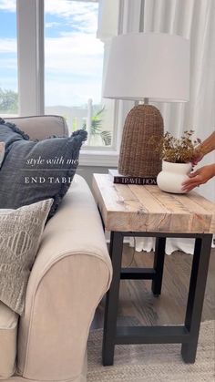 a living room with a couch, coffee table and window