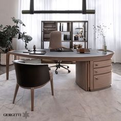 an office desk with two chairs in front of it