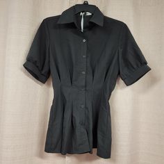 Grace Karin, Women's Peplum Black Button Down, Short Sleeve Blouse, W/ V-Neck Size: S, 65% Polyester & 5% Spandex (New) Fitted V-neck Blouse With Buttons, Fitted V-neck Shirt With Button Closure, Fitted Office Blouse With Back Button Closure, Fitted Blouse With Covered Buttons For Office, Fitted Blouse With Back Button Closure For Office Wear, Fitted Tops With Covered Buttons For Office, Fitted Short Sleeve Blouse With Button Closure, Fitted Short Sleeve Blouse With Buttons, Fitted Collared Blouse With Buttons