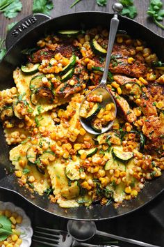 a skillet filled with zucchini and corn