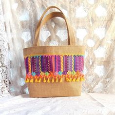 Immerse yourself in the summer spirit with our magnificent hippie boho burlap basket tote bag in vibrant purple and yellow. This colorful and cheerful accessory is perfect for sunny days, beach walks and summer getaways. In addition to being trendy, this bag embodies the boho spirit with its natural burlap texture, its ethnic fabric and its ribbon and braid ornaments. Its large capacity and natural cotton canvas lining allow you to easily carry everything you need during your summer outings. Let Spring Floral Prints, Boho Tote Bag, Unique Tote Bag, Boho Tote, Basket Tote, Pink Spring, Basket Bag, Beach Bag, Shoulder Bag Women