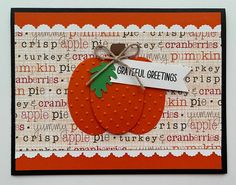 a close up of a card with an orange and white pumpkin on it, tied with a ribbon