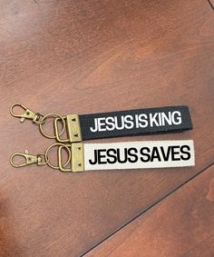 a keychain that says jesus is king and the word jesusaves on it